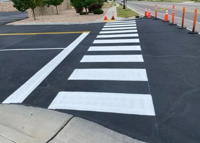 Clearly marked walkways help separate foot traffic from moving vehicles in busy paved areas.